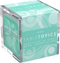 A clear acrylic cube containing a stack of teal cards labeled 